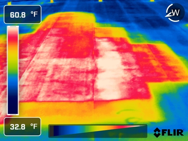 Infrared scan of a commercial roof: the bright warm area is wet insulation holding heat