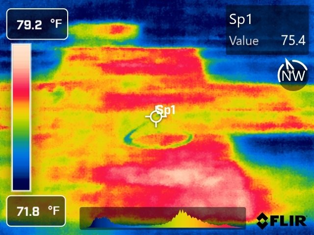 Infrared scan with a spot temperature reading on a warm, wet roof area